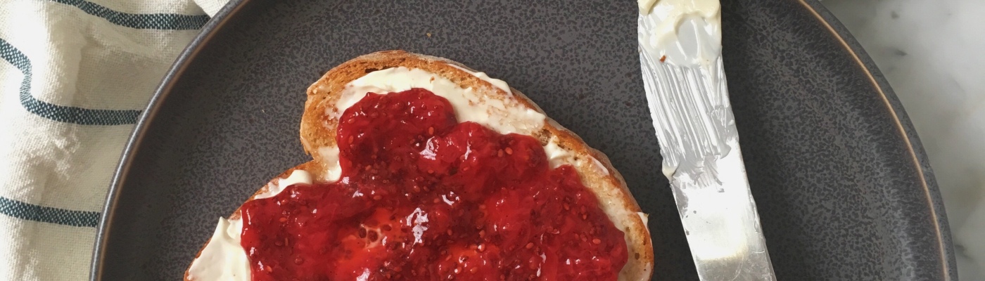 strawberry jam with chia seeds on toast with plant based butter